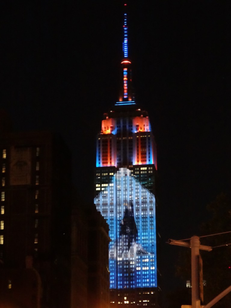 Whale projected against Empire State Buildilng